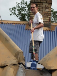 Andrew J Wharton paints villa roof in Coromandel Penninsula, New Zealand