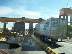 Dave Clingman and Andrew Wharton approach a toll booth on Mexico cuota (toll road)
